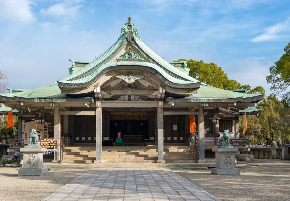 Main hall of Hokoku Shrine with green copper roof in Osaka Castle Park